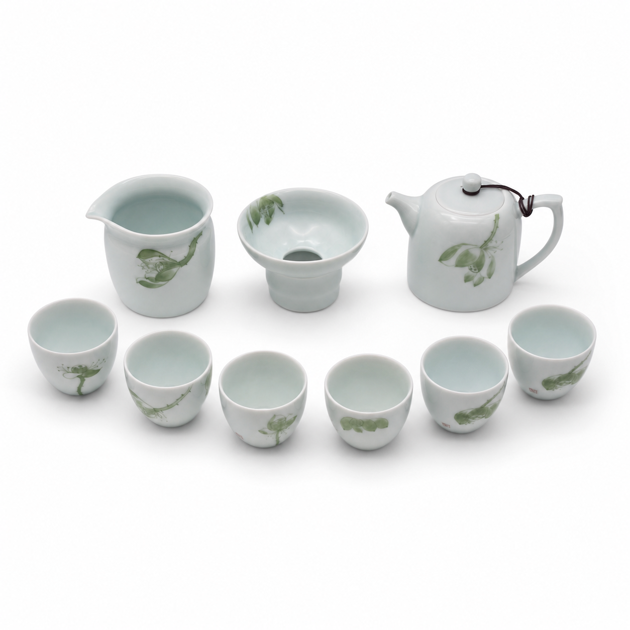 Nine-piece celadon tea set, elevated white studio view