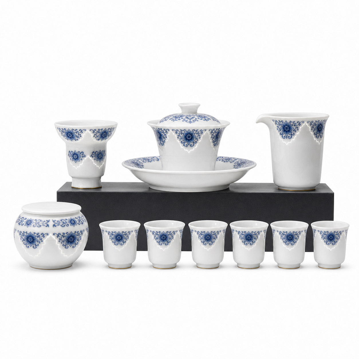 White studio view with black riser for Linglong porcelain gaiwan tea set