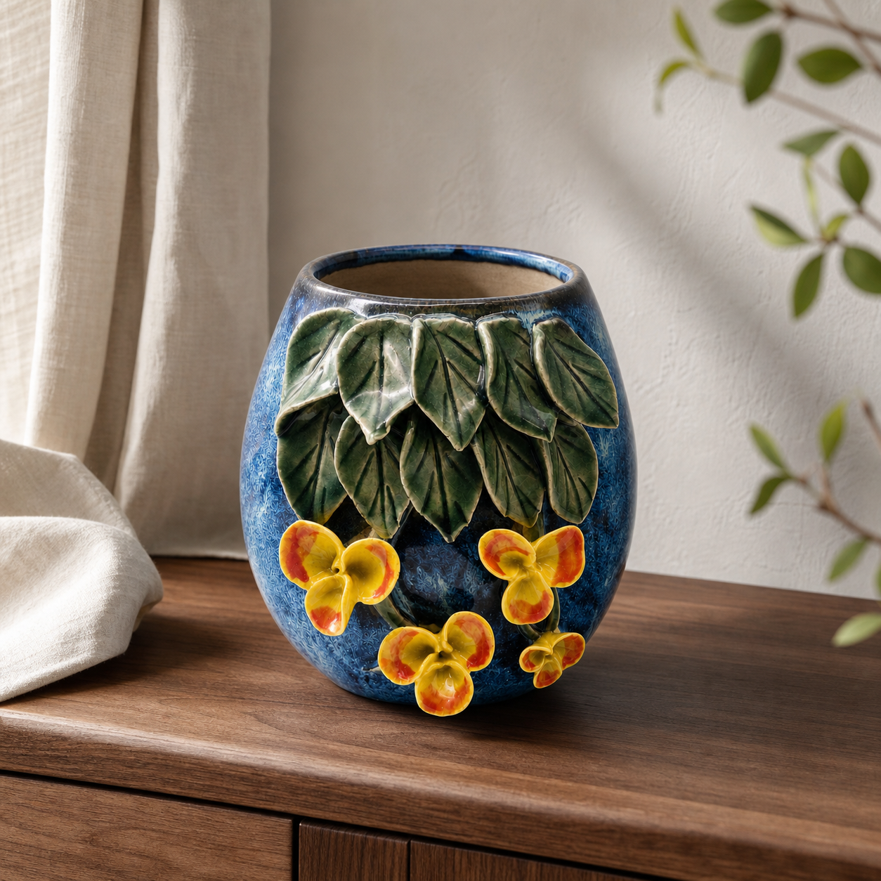 Verdurous Flora ceramic vessel on a warm walnut console