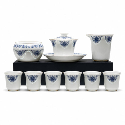 Blue-and-white Linglong porcelain gongfu tea set on white studio background